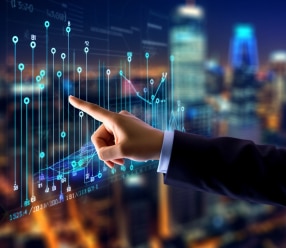 Businessman interacting with futuristic digital financial graphs Businessman interacting with futuristic digital financial graphs
